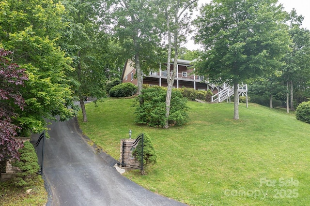 6 Grouse Ter, Fairview, NC 28730 - view of front of house featuring driveway and a front lawn