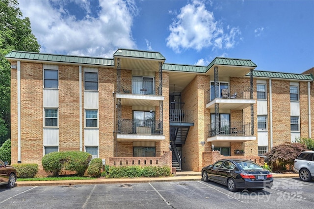4736 Hedgemore Dr Unit K, Charlotte, NC 28209 - view of property featuring uncovered parking