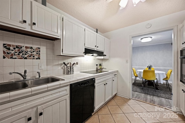 4736 Hedgemore Dr Unit K, Charlotte, NC 28209 - kitchen with black appliances, white cabinetry, tile counters, tasteful backsplash, and a textured ceiling