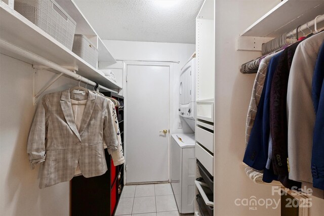 4736 Hedgemore Dr Unit K, Charlotte, NC 28209 - walk in closet with light tile patterned flooring and washer / clothes dryer