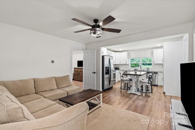 5740 Crouse Rd, Crouse, NC 28033 - living area featuring ceiling fan and light wood finished floors