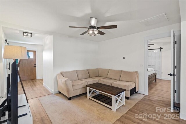 5740 Crouse Rd, Crouse, NC 28033 - living room with a ceiling fan and light wood-style floors