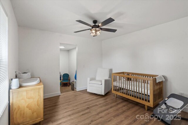 5740 Crouse Rd, Crouse, NC 28033 - bedroom with wood finished floors and ceiling fan