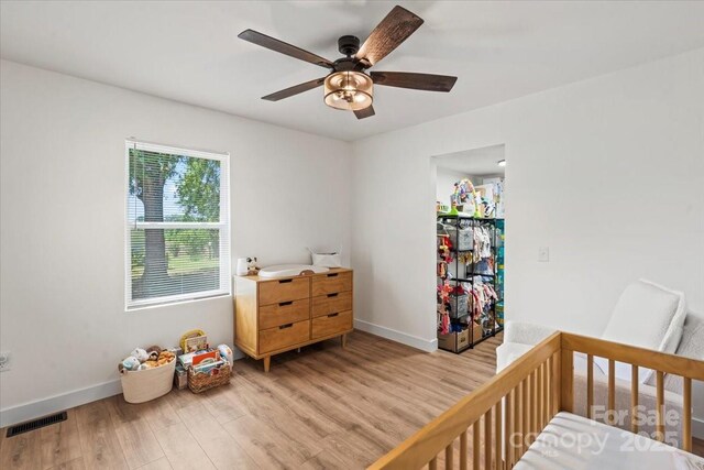 5740 Crouse Rd, Crouse, NC 28033 - bedroom featuring light wood-type flooring and ceiling fan