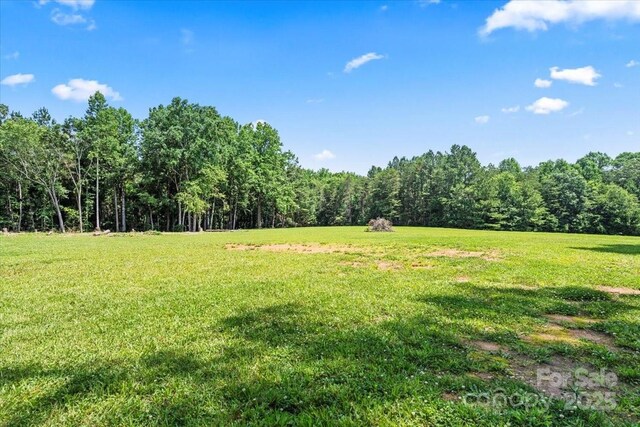 5740 Crouse Rd, Crouse, NC 28033 - view of grassy yard with a wooded view