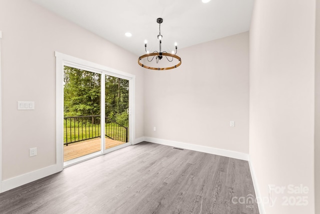 1471 Marshbrooke Ln, Catawba, NC 28609 - unfurnished room featuring a chandelier, wood finished floors, and recessed lighting