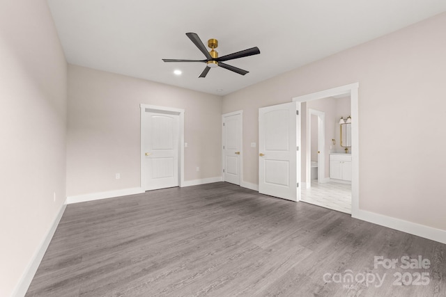 1471 Marshbrooke Ln, Catawba, NC 28609 - unfurnished bedroom with dark wood finished floors, connected bathroom, recessed lighting, and a ceiling fan