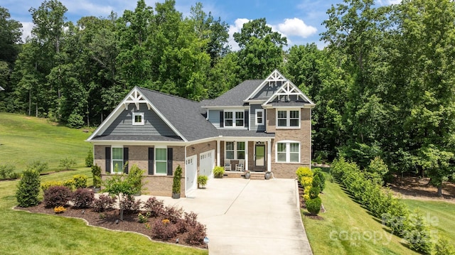 322 Ethan Ln, Rock Hill, SC 29732 - craftsman-style house featuring an attached garage, brick siding, concrete driveway, and a front lawn