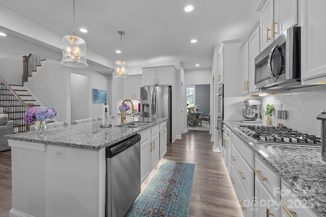 322 Ethan Ln, Rock Hill, SC 29732 - kitchen featuring stainless steel appliances, a kitchen island with sink, backsplash, recessed lighting, and light stone counters