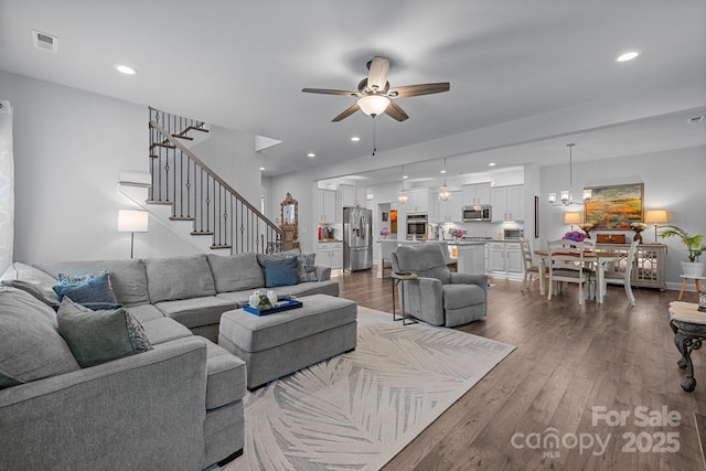 322 Ethan Ln, Rock Hill, SC 29732 - living room featuring a ceiling fan, wood finished floors, stairs, recessed lighting, and a chandelier