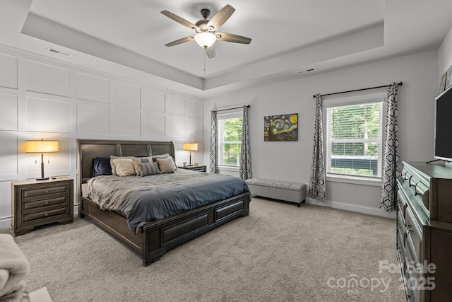 322 Ethan Ln, Rock Hill, SC 29732 - bedroom featuring a raised ceiling, carpet, multiple windows, and a ceiling fan