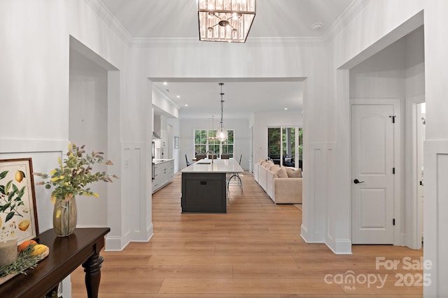 8283 Long Island Rd, Catawba, NC 28609 - entryway with a chandelier, crown molding, and light wood-type flooring