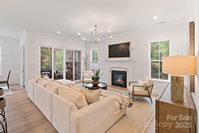 8283 Long Island Rd, Catawba, NC 28609 - living area with ornamental molding, light wood finished floors, plenty of natural light, a chandelier, and recessed lighting