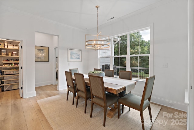 8283 Long Island Rd, Catawba, NC 28609 - dining room featuring a chandelier, ornamental molding, and light wood finished floors