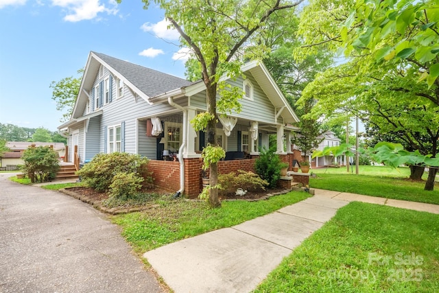 153 S Center St, Taylorsville, NC 28681 - view of side of property featuring covered porch, a yard, and roof with shingles