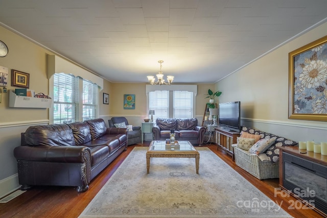 153 S Center St, Taylorsville, NC 28681 - living area with a chandelier, ornamental molding, and wood finished floors