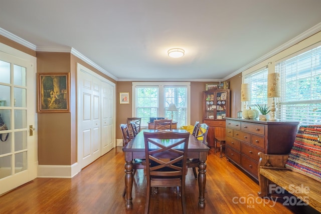 153 S Center St, Taylorsville, NC 28681 - dining area featuring wood finished floors, crown molding, and baseboards