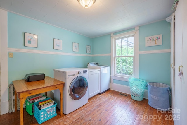 153 S Center St, Taylorsville, NC 28681 - washroom with independent washer and dryer and light wood-type flooring