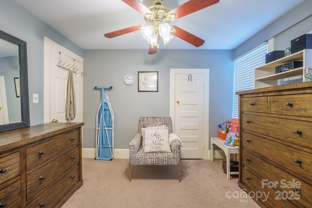 153 S Center St, Taylorsville, NC 28681 - living area with ceiling fan, light carpet, and baseboards