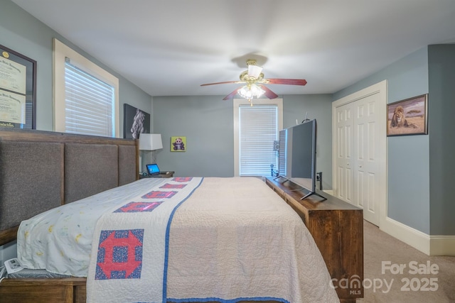 153 S Center St, Taylorsville, NC 28681 - bedroom with carpet floors, baseboards, ceiling fan, and a closet