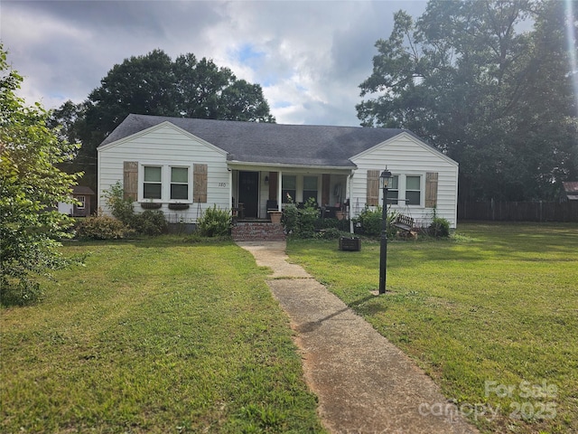 180 Vance Price Rd, Forest City, NC 28043 - view of front of property featuring covered porch, a front yard, and roof with shingles