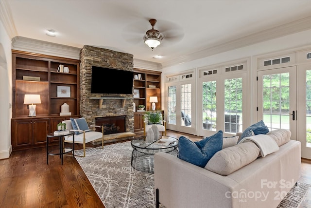 1500 Lookout Cir, Waxhaw, NC 28173 - living area featuring ceiling fan, ornamental molding, dark wood finished floors, and a fireplace