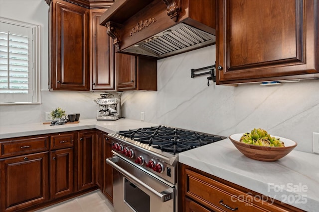 1500 Lookout Cir, Waxhaw, NC 28173 - kitchen with custom exhaust hood, high end stove, and light countertops