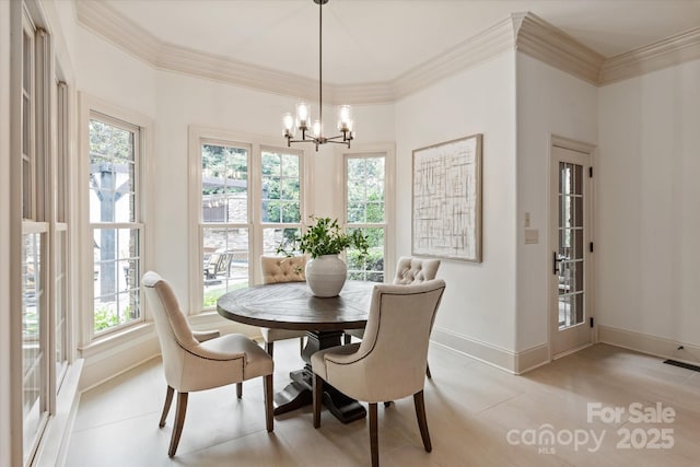1500 Lookout Cir, Waxhaw, NC 28173 - dining space featuring a chandelier, plenty of natural light, and crown molding