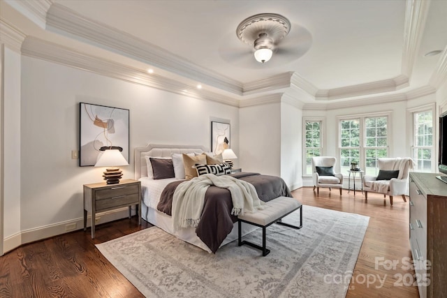 1500 Lookout Cir, Waxhaw, NC 28173 - bedroom with a raised ceiling, dark wood-type flooring, crown molding, and ceiling fan