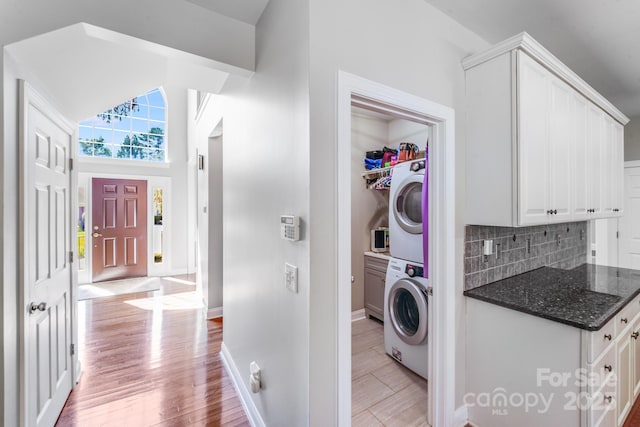 15811 Burlingame Dr, Huntersville, NC 28078 - washroom featuring estacked washer and dryer and light wood-style flooring