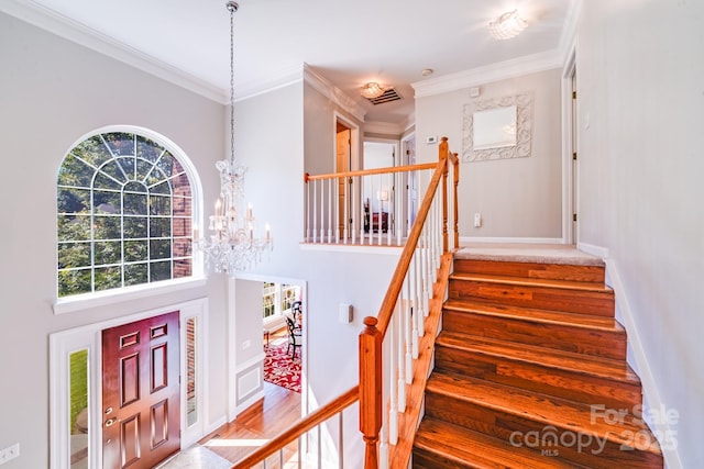15811 Burlingame Dr, Huntersville, NC 28078 - foyer featuring wood finished floors, stairs, plenty of natural light, a chandelier, and ornamental molding