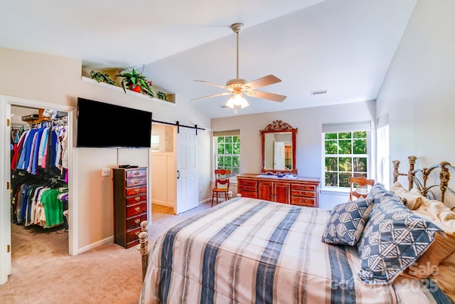 15811 Burlingame Dr, Huntersville, NC 28078 - bedroom featuring a spacious closet, a barn door, multiple windows, a closet, and lofted ceiling