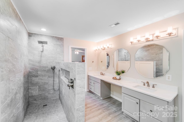 15811 Burlingame Dr, Huntersville, NC 28078 - bathroom featuring double vanity, walk in shower, ceiling fan, a fireplace, and recessed lighting