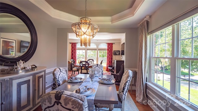 15811 Burlingame Dr, Huntersville, NC 28078 - dining space with ornamental molding, wainscoting, a chandelier, healthy amount of natural light, and a decorative wall