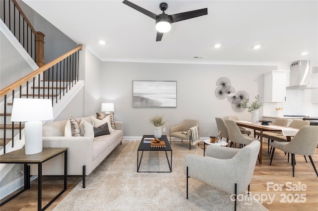 2003 Ashley Rd Unit B, Charlotte, NC 28208 - living area featuring stairway, ceiling fan, light wood-type flooring, crown molding, and recessed lighting