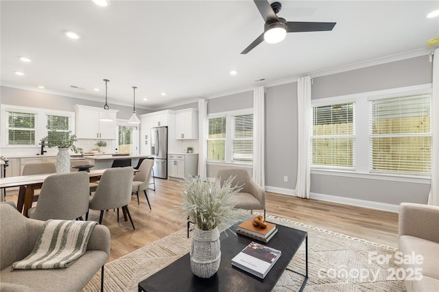 2003 Ashley Rd Unit B, Charlotte, NC 28208 - living area featuring crown molding, light wood-style floors, recessed lighting, and ceiling fan