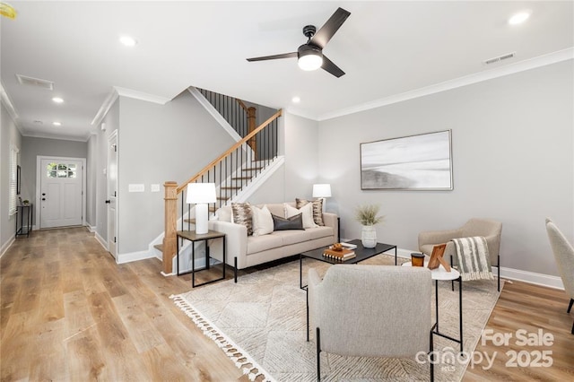 2003 Ashley Rd Unit B, Charlotte, NC 28208 - living room with ornamental molding, stairway, light wood-style flooring, ceiling fan, and recessed lighting