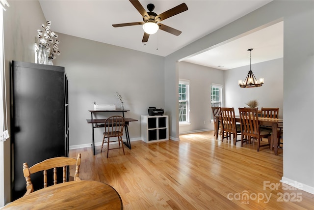 4000 Garfield Ct, Waxhaw, NC 28173 - dining room with ceiling fan, light wood-style flooring, and a chandelier