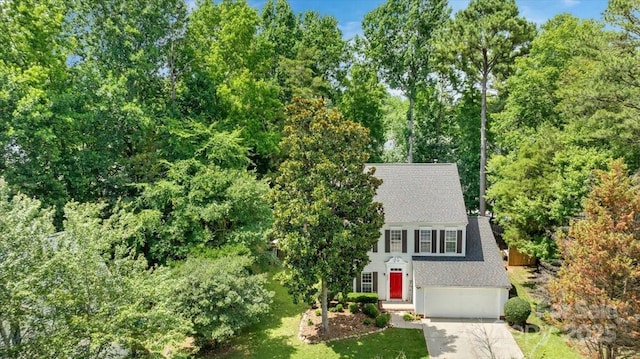 4000 Garfield Ct, Waxhaw, NC 28173 - view of front of house featuring driveway, a shingled roof, an attached garage, and a front lawn