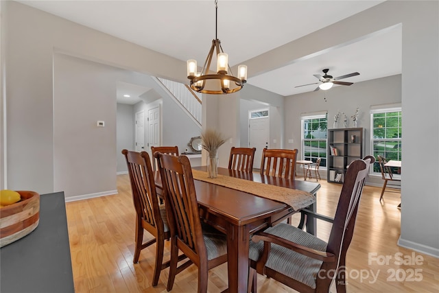 4000 Garfield Ct, Waxhaw, NC 28173 - dining space featuring light wood-type flooring, a ceiling fan, and a chandelier