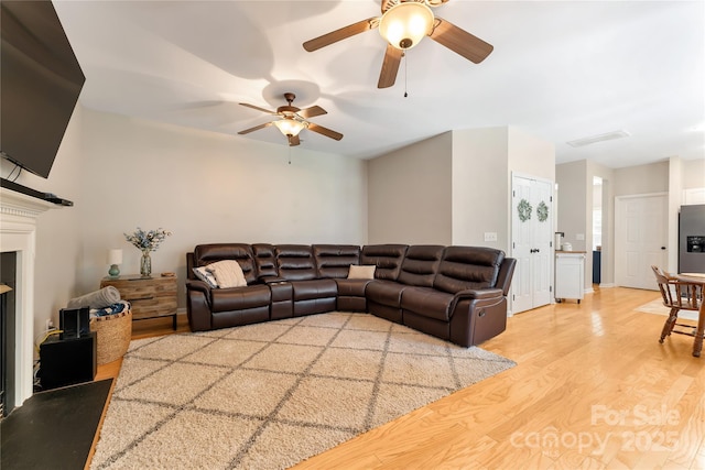 4000 Garfield Ct, Waxhaw, NC 28173 - living room with light wood-style floors and a ceiling fan