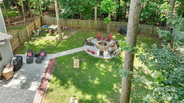 4000 Garfield Ct, Waxhaw, NC 28173 - fenced backyard with a fire pit and a patio area