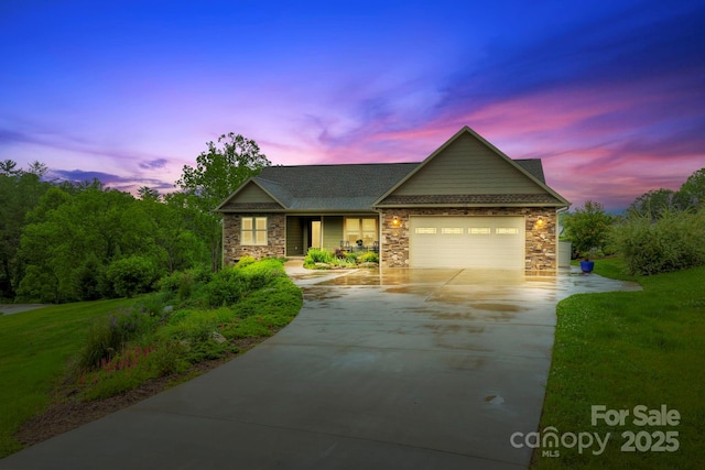 288 Ollie Weaver Rd, Weaverville, NC 28787 - view of front facade with concrete driveway, a garage, stone siding, roof with shingles, and a lawn