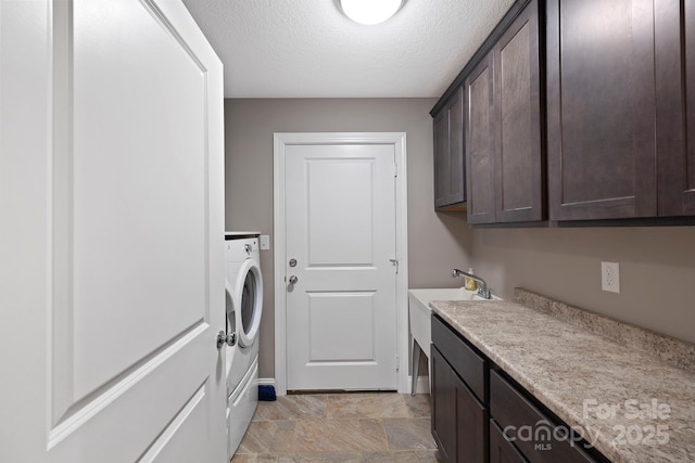 288 Ollie Weaver Rd, Weaverville, NC 28787 - laundry room with cabinet space, a textured ceiling, and washer / dryer