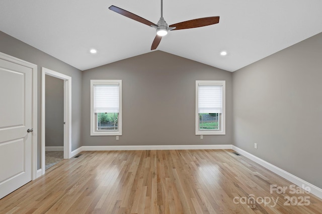 288 Ollie Weaver Rd, Weaverville, NC 28787 - unfurnished bedroom with multiple windows, vaulted ceiling, light wood-type flooring, ceiling fan, and recessed lighting