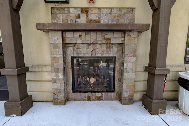 720 Governor Morrison St Unit 221, Charlotte, NC 28211 - detailed view of a stone fireplace and concrete flooring