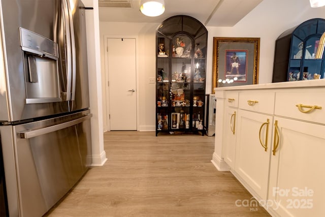720 Governor Morrison St Unit 221, Charlotte, NC 28211 - bar with stainless steel fridge, light wood-style flooring, and arched walkways