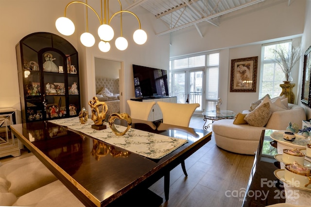 720 Governor Morrison St Unit 221, Charlotte, NC 28211 - dining space with high vaulted ceiling and wood finished floors