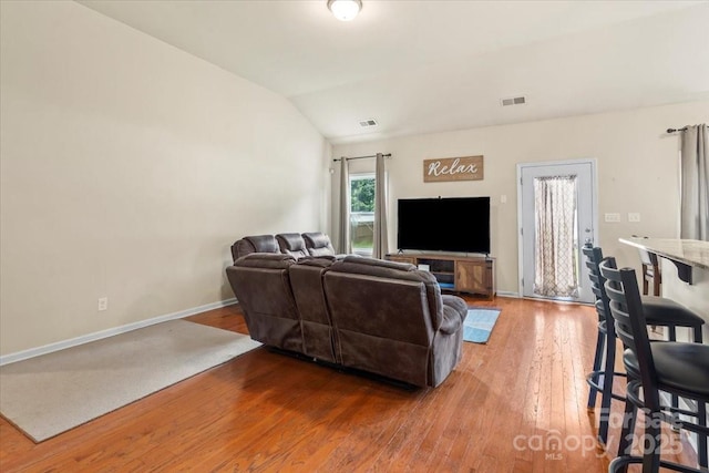 5111 Elementary View Dr, Charlotte, NC 28269 - living room featuring vaulted ceiling and hardwood / wood-style floors