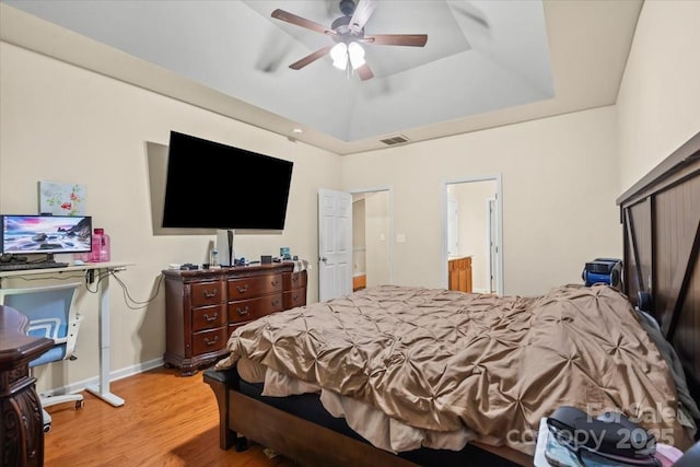 5111 Elementary View Dr, Charlotte, NC 28269 - bedroom featuring a raised ceiling, wood finished floors, a ceiling fan, and ensuite bath